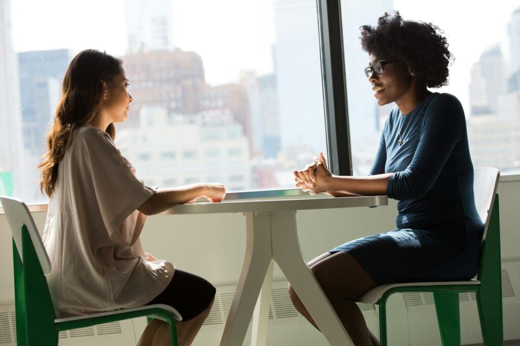 Two women in a supportive employment mentoring conversation